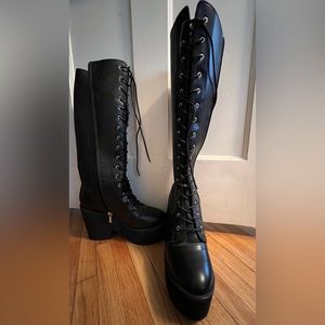 Platform knee high boots.